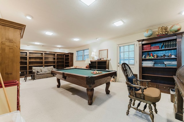 game room with crown molding, billiards, light carpet, and a textured ceiling