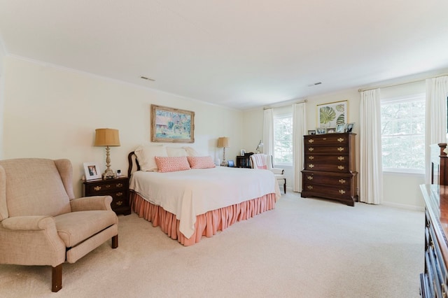 carpeted bedroom featuring ornamental molding