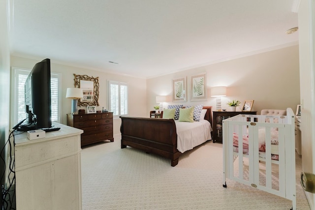 bedroom featuring crown molding and light colored carpet