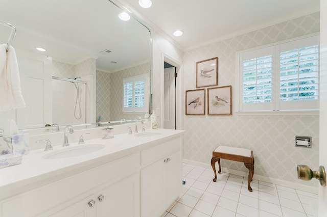 bathroom with crown molding, vanity, tile patterned flooring, and a shower