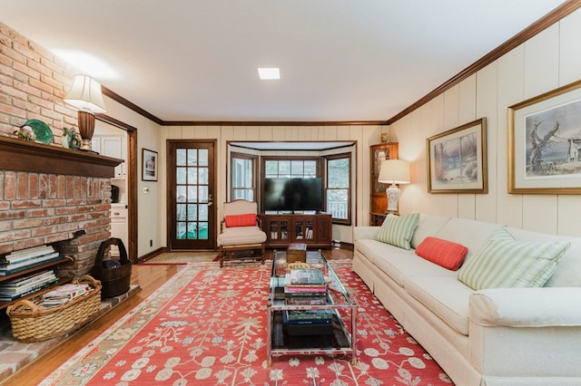 living room featuring hardwood / wood-style flooring, crown molding, and a wealth of natural light