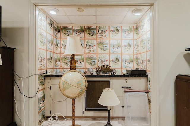 miscellaneous room with a paneled ceiling