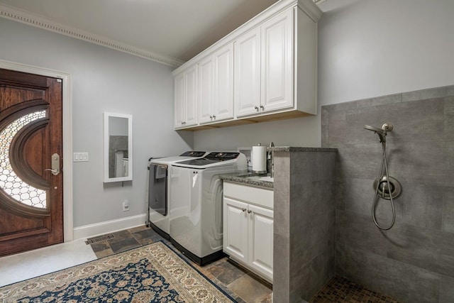 washroom with cabinets and separate washer and dryer