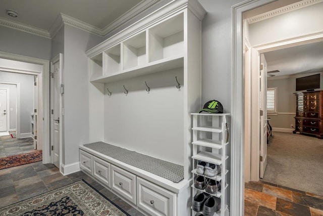 mudroom featuring ornamental molding and dark colored carpet