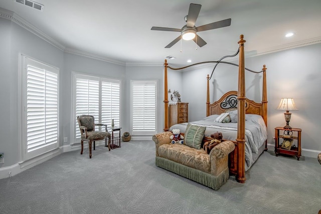 carpeted bedroom with crown molding and ceiling fan