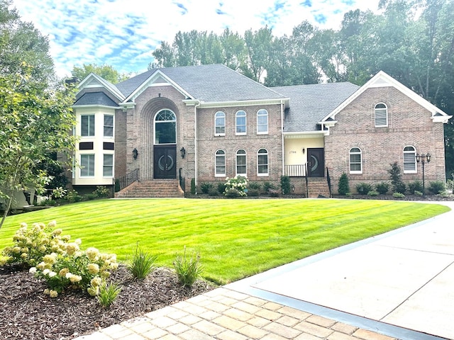 view of front of home with a front yard