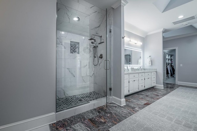 bathroom with vanity, ornamental molding, and walk in shower