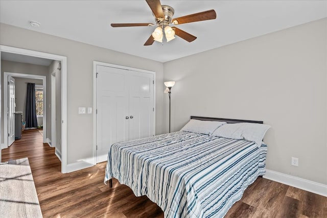 bedroom with ceiling fan, dark hardwood / wood-style flooring, and a closet