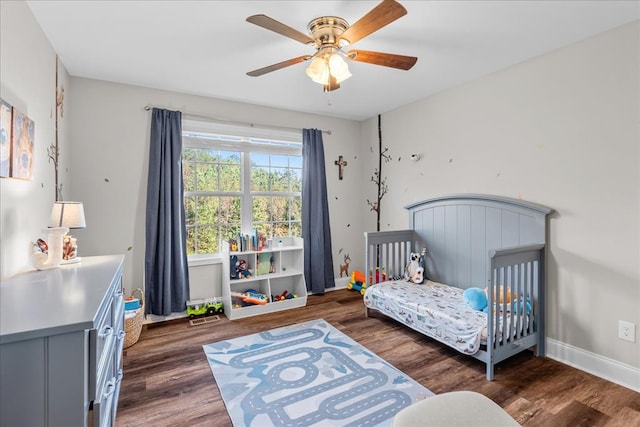 bedroom featuring dark wood-type flooring and ceiling fan