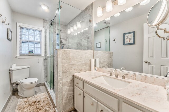 bathroom featuring a tub with jets, double vanity, a sink, and lofted ceiling