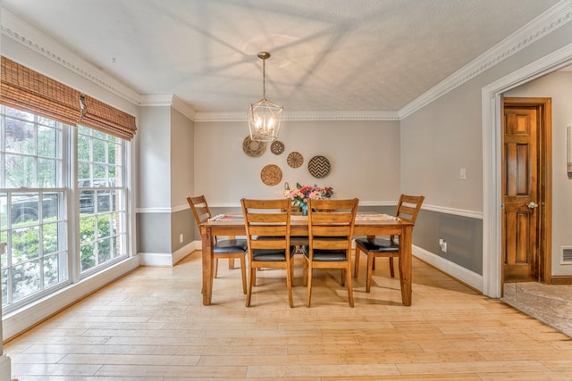 foyer entrance with baseboards, stairway, a notable chandelier, and crown molding