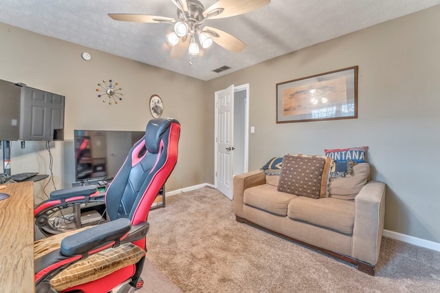bedroom with baseboards, visible vents, carpet floors, and a textured ceiling
