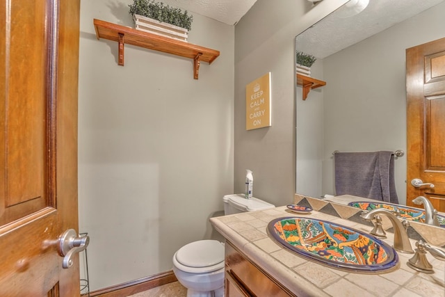 dining room with baseboards, ornamental molding, a ceiling fan, and a textured ceiling