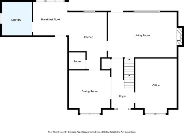 colonial inspired home with a chimney, concrete driveway, an attached garage, and brick siding