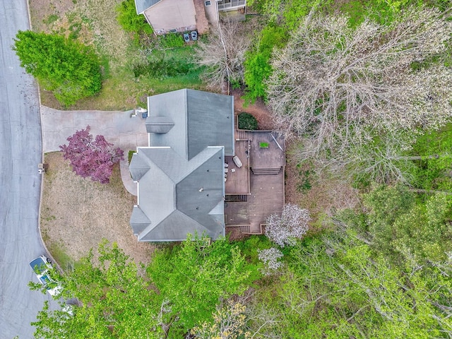 view of front of home featuring concrete driveway, a garage, and brick siding