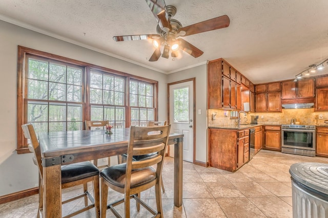 kitchen featuring black dishwasher, ceiling fan, backsplash, and a sink