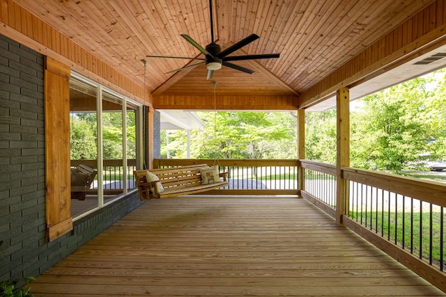 wooden terrace with a ceiling fan