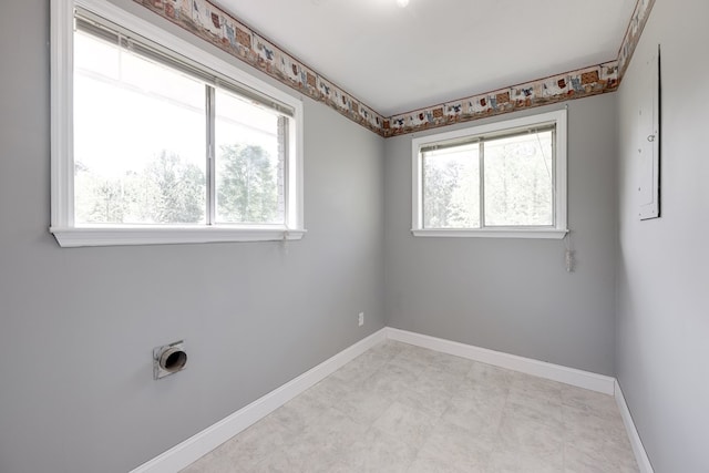 empty room featuring baseboards
