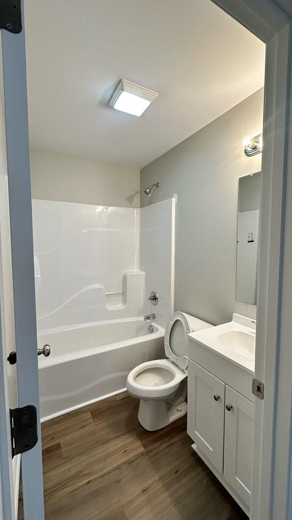 1420 Cleo Way, Dalton, GA 30720 - full bathroom with toilet, vanity, bathing tub / shower combination, and wood finished floors