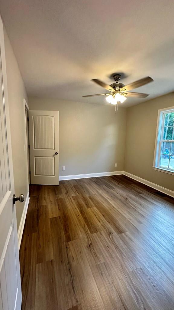 1420 Cleo Way, Dalton, GA 30720 - spare room with wood finished floors, a ceiling fan, and baseboards