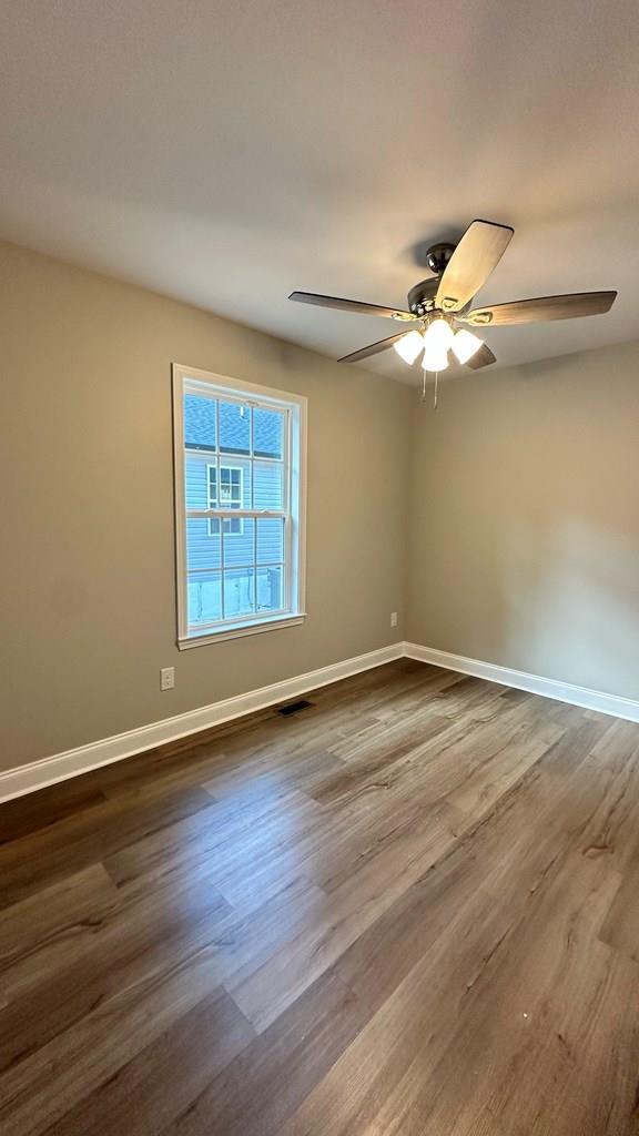1420 Cleo Way, Dalton, GA 30720 - spare room with ceiling fan, dark wood-type flooring, and baseboards