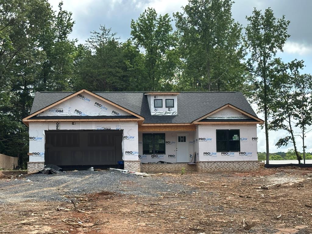401 Earls Way, Chatsworth, GA 30705 - unfinished property with a shingled roof and an attached garage