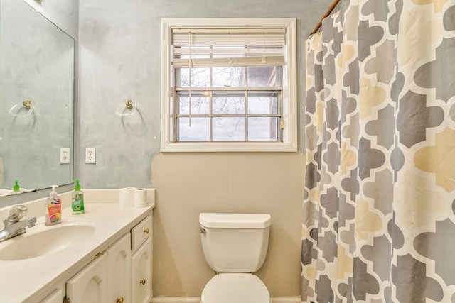 full bath with a shower with shower curtain, toilet, and vanity