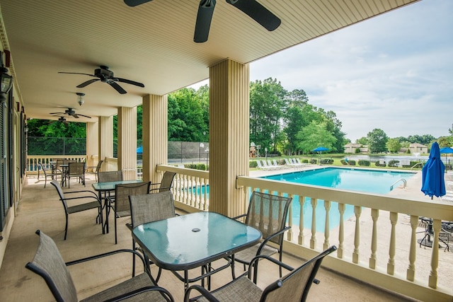 view of patio / terrace with a community pool and ceiling fan