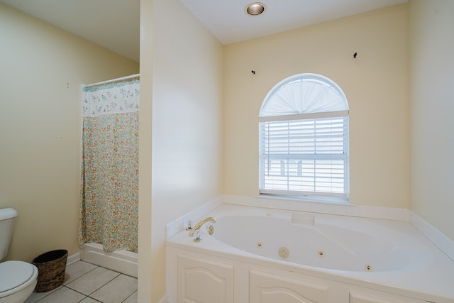 bathroom featuring tile patterned flooring, independent shower and bath, and toilet