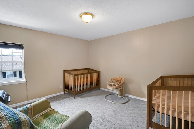 carpeted bedroom featuring a textured ceiling