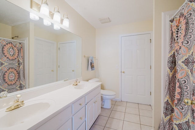 bathroom with vanity, a shower with curtain, tile patterned floors, and toilet