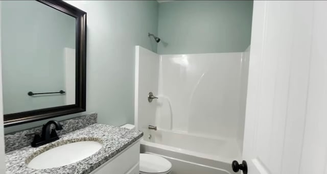 full bathroom featuring vanity, tub / shower combination, and toilet