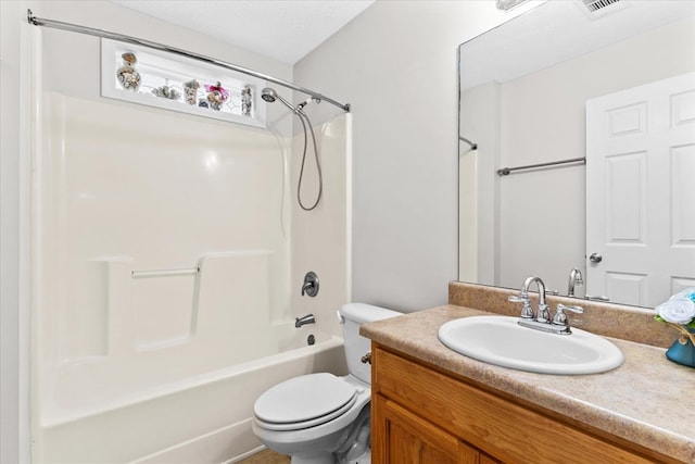 full bathroom featuring vanity, bathing tub / shower combination, and toilet