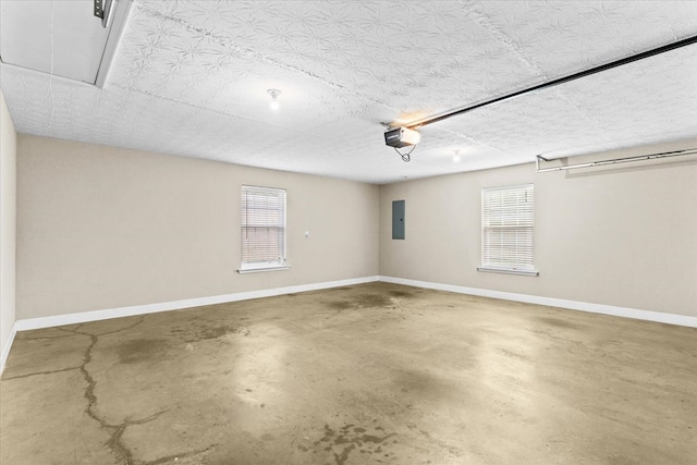 garage featuring a garage door opener and electric panel