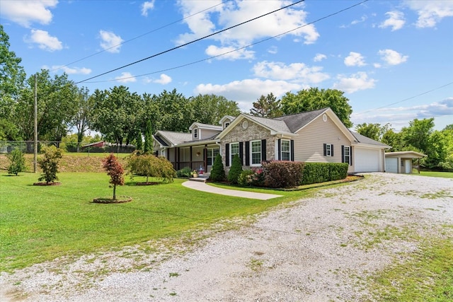 ranch-style home featuring a garage and a front yard