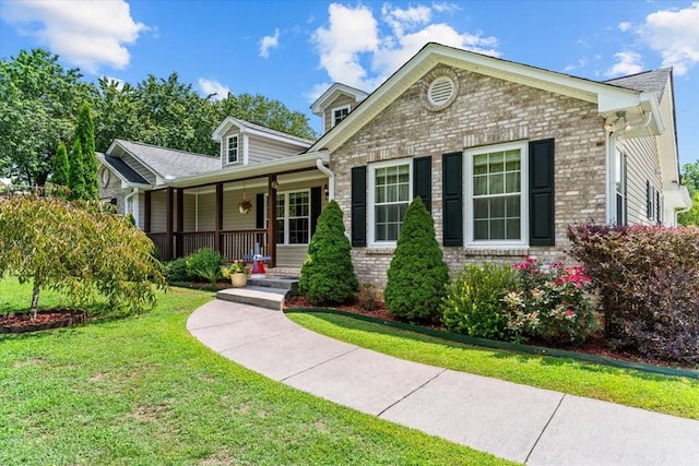 view of front of house with a front lawn and covered porch