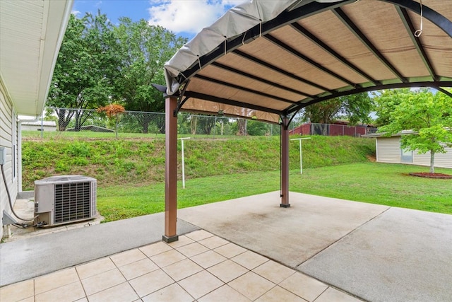 view of patio / terrace with central AC unit and an outbuilding