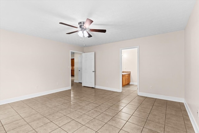 spare room featuring a textured ceiling and ceiling fan