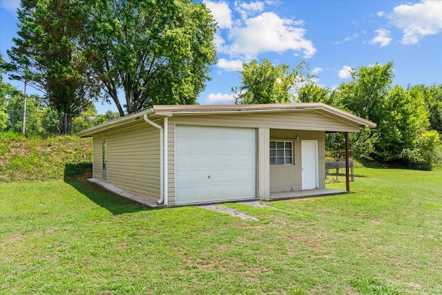 garage with a yard