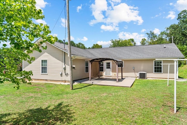 rear view of house with a patio area, a yard, central AC unit, and a pergola