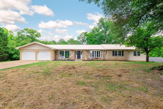 3414 Chattanooga Rd, Tunnel Hill, GA 30755 - single story home with stone siding, an attached garage, concrete driveway, and a front yard