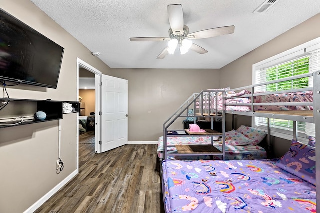 3414 Chattanooga Rd, Tunnel Hill, GA 30755 - bedroom featuring wood finished floors, a textured ceiling, and a ceiling fan