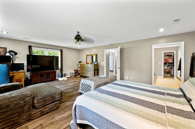 3414 Chattanooga Rd, Tunnel Hill, GA 30755 - bedroom with a textured ceiling, wood finished floors, recessed lighting, and a ceiling fan