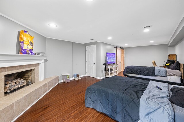 3414 Chattanooga Rd, Tunnel Hill, GA 30755 - bedroom with wood finished floors, recessed lighting, a fireplace, and crown molding