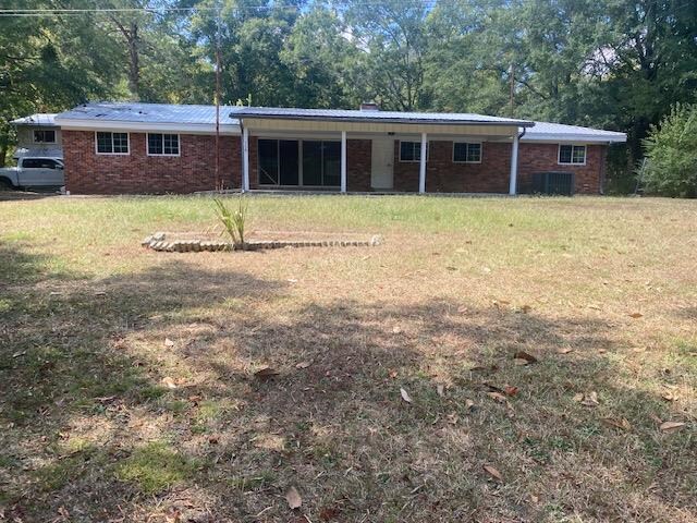 758 Mill Creek Rd, Rocky Face, GA 30740 - rear view of house with a lawn