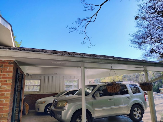 view of vehicle parking featuring an attached carport