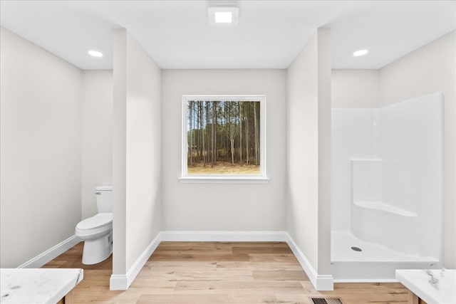 288 Flag Way, Chatsworth, GA 30705 - full bath with walk in shower, baseboards, wood finished floors, toilet, and vanity
