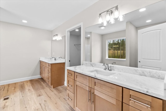 288 Flag Way, Chatsworth, GA 30705 - full bathroom featuring a sink, two vanities, wood finished floors, baseboards, and visible vents