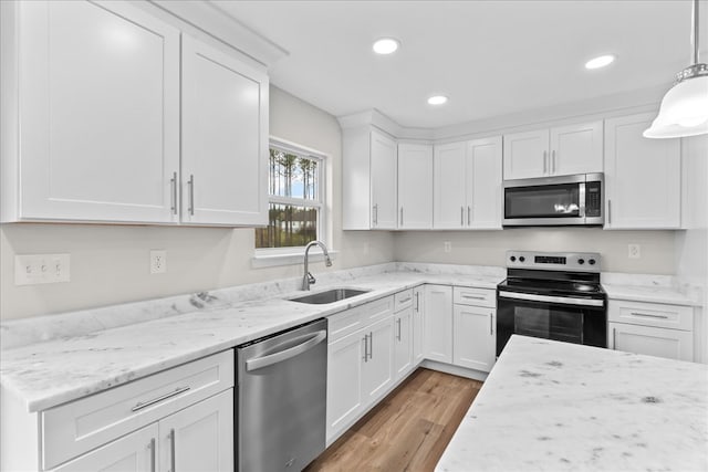 288 Flag Way, Chatsworth, GA 30705 - kitchen featuring white cabinetry, recessed lighting, a sink, light wood-style floors, and appliances with stainless steel finishes
