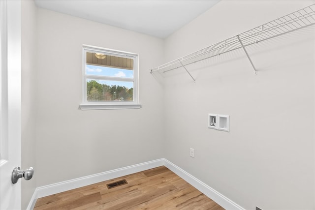288 Flag Way, Chatsworth, GA 30705 - laundry room featuring visible vents, washer hookup, baseboards, laundry area, and light wood-type flooring